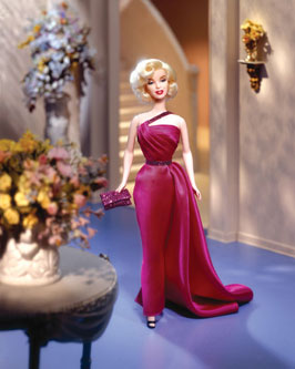Though her life was as brief as a candle in the wind, the legend of Marilyn lives on. In Mattel’s tribute to "How to Marry a Millionaire", the screen goddess is vibrant and delectable in a magenta one-shouldered evening gown plus a coral bathing suit and cover-up. Twice the Marilyn for twice the thrills! This special package is priced at $59.95.