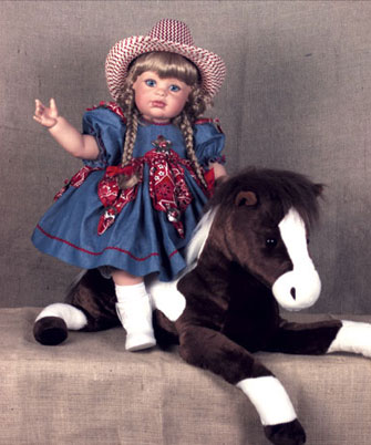 : Giddyup, pardner! “Calamity”—all 26 inches of her—is riding high on her favorite fuzzy steed. She’s decked out with a cowboy hat and boots, plus a denim dress trimmed with bandanna-print triangles on the skirt, sleeves and bodice; each triangle sports a silver concho. From this edition of 100, “Calamity” can be purchased solo for $290 or for $355 with her horse.