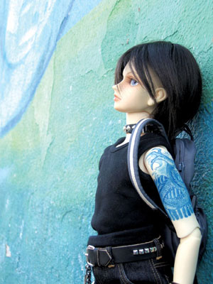 A male Volks Super Dollfie sports an intricate tattoo that was created by Dollfie collector Aimee Steinberger.