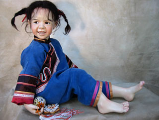 This charming Chinese girl can occupy herself with the universal gesture of hair twirling. 