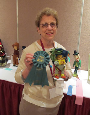 Elaine Romberg won the Best of Show ribbon in the Competitive Exhibit for her exceptional Lenci Leprechaun Gnome type character doll.