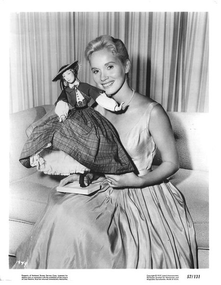 Eva Marie Saint holding a doll