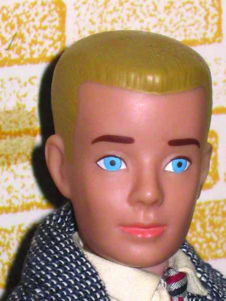 The second version of Ken from 1962 had a molded crew cut in both brunette and blond versions. Later models would feature bendable knees.