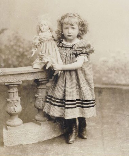 Antique photo of girl with doll