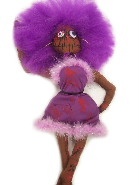 Ms. Classy combines a Vegas vibe with a horror aura. She’s a 23-inch Creepy Doll.