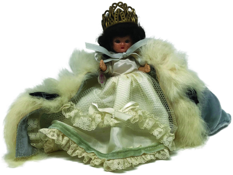 This very rare example of the 5-inch Queen for a Day doll has a blue cape.