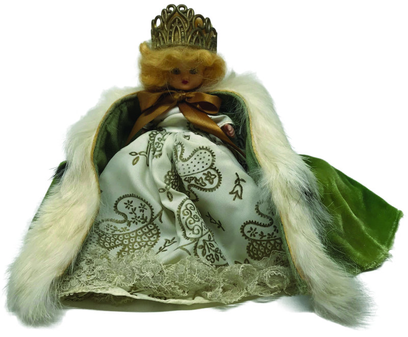 This very rare 5-inch Queen for a Day doll has a green cape over a vintage paisley print gown.