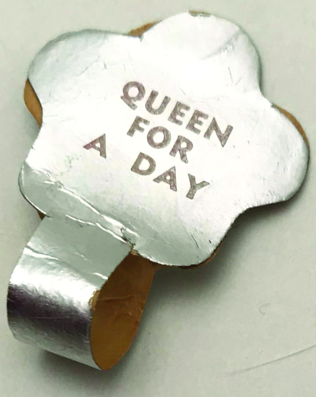 The Queen for a Day dolls wore this silver wrist tag.