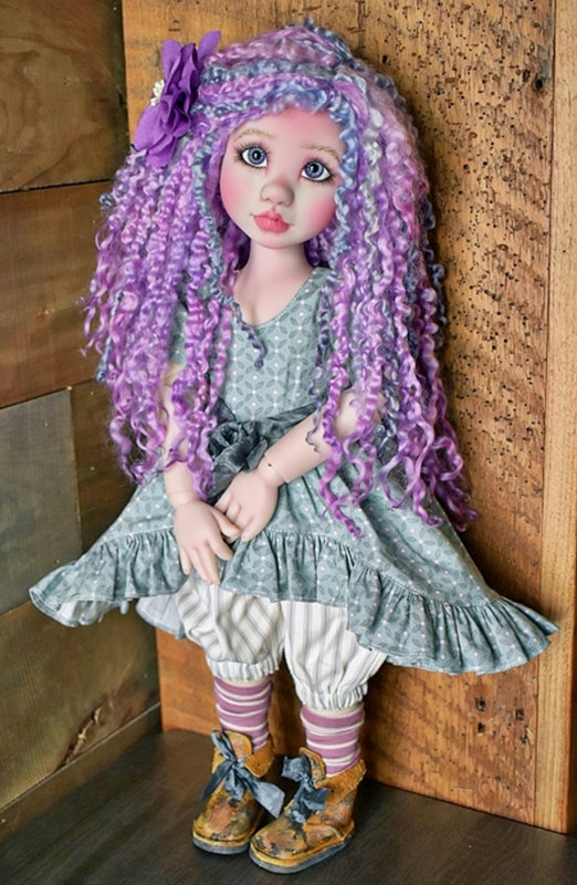 A custom-finished 18-inch Kimmie in lavender resin with a custom wool wig.