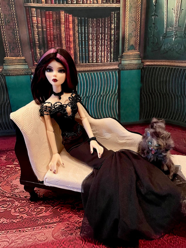 Ralph Gilson: “Here is Evangeline last night getting ready to leave for the New Year's Eve gala. She is wearing a OOAK beaded dress by Kamelia Doll Fashion and took the time to pose for a pic with her cat Sybil.”