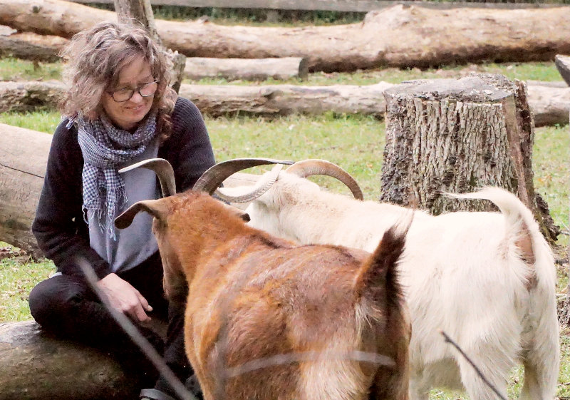 “This is me with two of my goats: Rosa, the red goat, and her daughter Elenor. They both produce wonderful soft fiber.”