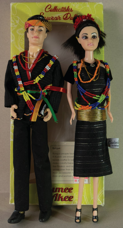 In Sabah, Borneo, we saw this set of dolls in Rungus ethnic costume called Humee & Akee. The text on the back of the box is very interesting: ‘Humee’ name is derived from the legend of Huminodun, the pure Kadazan Dunsun girl who sacrificed herself to save the people of North Borneo from the devastation and suffering of a very long drought. Nowadays, Huminodun’s sacrifice is honored by the selection of the Unduk Ngadau or Runduk Ngadau Pageant during the yearly Harvest Festival Celebration. As with the Indian dolls I found in Leh in Ladakh, these dolls are not intended for kids. They’re really about representing a culture to other adults as tourist souvenirs. The dolls are poor quality, but the costumes and beading are lovely.