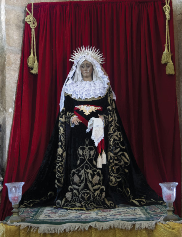 A statue of the Virgin Mary in the cathedral in Santo Domingo, Dominican Republic. There were many statues like this in churches in the Caribbean and Mexico dressed in real robes in luxurious fabrics and with beautiful embroidery. A lot of these dressed figures are also doll-sized, like this one.