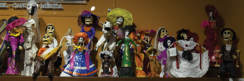 Day of the Dead dolls, such as these ones from Cancun, Mexico, come in a huge variety of materials, colors, and ethnic dress. However, these have more to do with beliefs than ethnic identity.