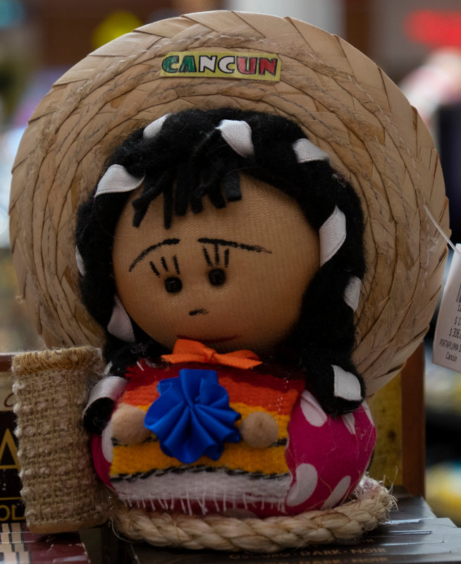 A souvenir doll at the Cancun airport. A lot of these cloth dolls had sad expressions on their faces.