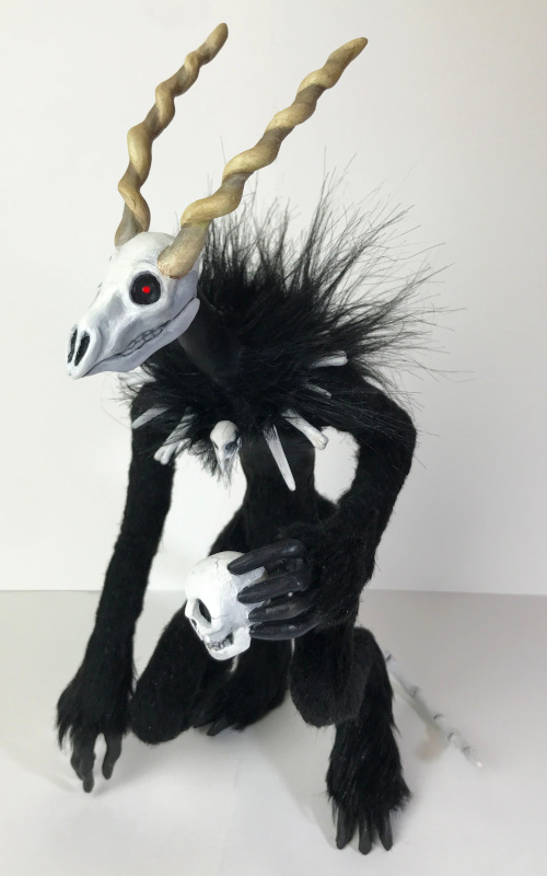 The artist used Apoxie Sculpt and faux fur to make this OOAK 11-inch Wendigo monster.
