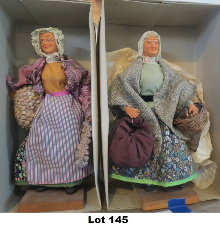 Lot 145 is two handcrafted French 10-inch dolls, one with braided garlic harvest and the second with a chicken in a basket.