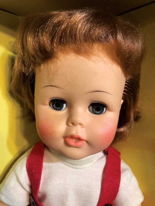 Closeup of rare redheaded Tiny Kissy doll.