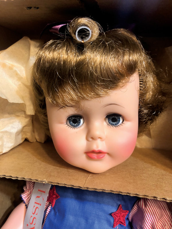 Closeup of 1963 Tiny Kissy doll's face.