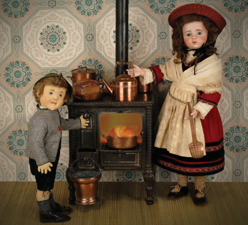 One highlight of this year’s World Doll Day Shows is the display of a rare Albert Marque doll (right) from 1915, courtesy of the Grovian Doll Museum of Pacific Grove, California. The doll is shown with her French 1870s to 1890s salesman sample stove and accessories, and an antique Steiff boy. Of the 100 dolls manufactured in 1915, less than 10 are known to exist in private collections today. Photo courtesy of Grovian Doll Museum