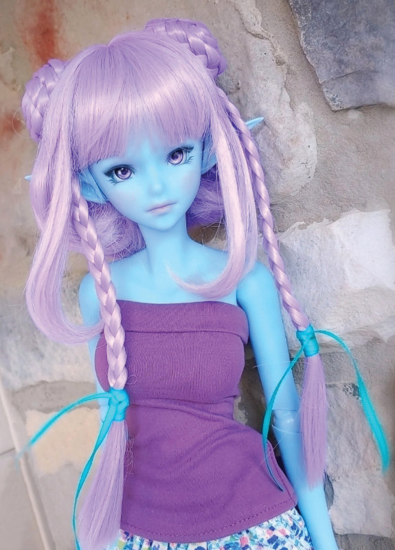 Everlee is a Smart Doll in interstellar blue with a Singularity Semi-Real face mold. She was painted using high pigment acrylics and soft chalks. Elf ears and violet eyes by Culture Japan give her a whimsical look.