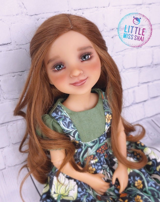 Sadie is a fully repainted 15-inch Ruby Red Fashion Friends Freida doll. I gave her an auburn heat-stylable wig and gray glass eyes.