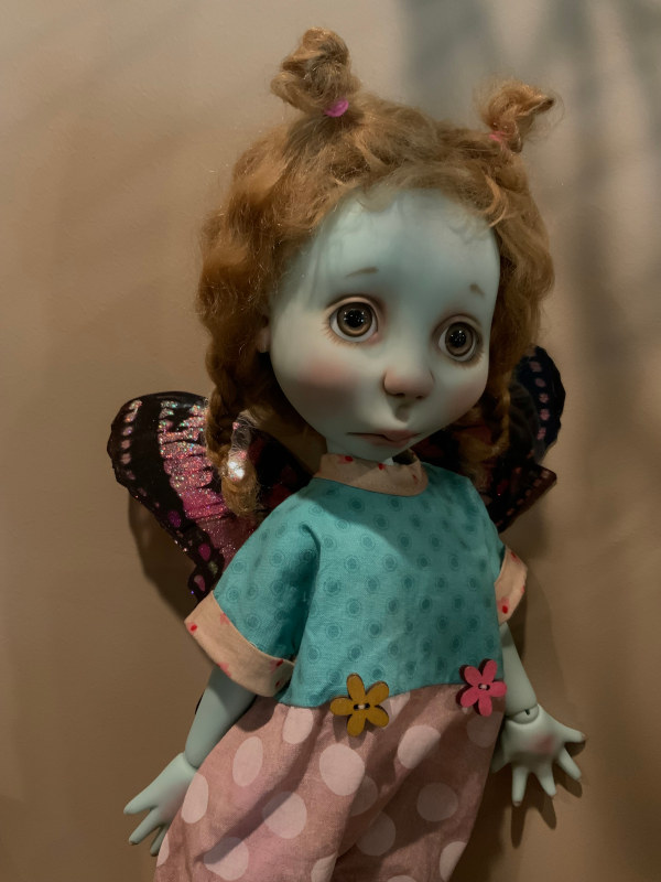 Eppie is a favorite among Lowe’s collectors. Here the beloved creation is shown in blue and milk chocolate resin.