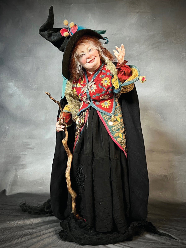 Esme the Gypsy Witch, 25 inches, is sculpted from polymer clay over a wire armature. Esme is dressed in antique and vintage materials and placed second in the International LightSpaceTime 3 Dimensional Art Category Competition this summer.