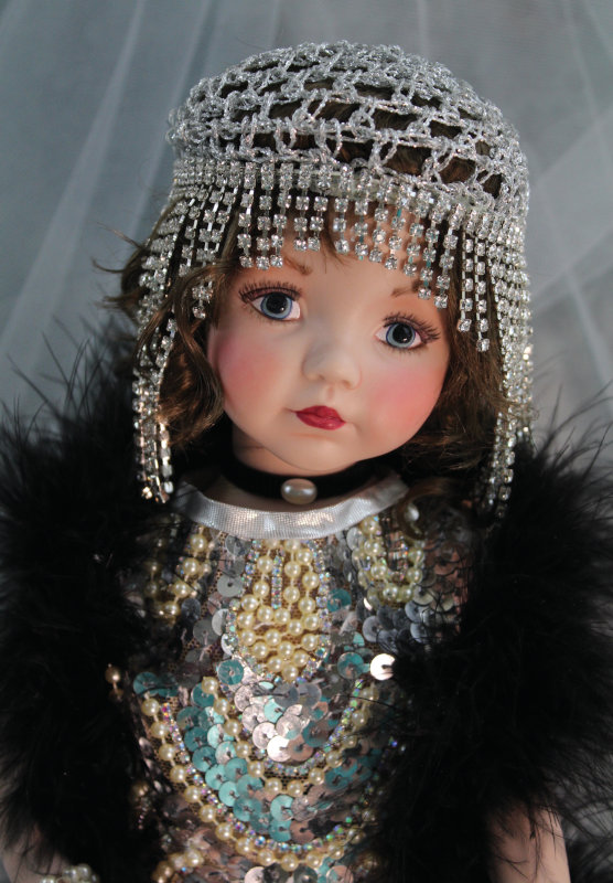 Mize loves to time travel via her doll creations. Mollie Rose is a 14-inch full-porcelain doll dressed in a custom 1920s costume. Her face sculpt is Dianna Effner’s Portrait #10.