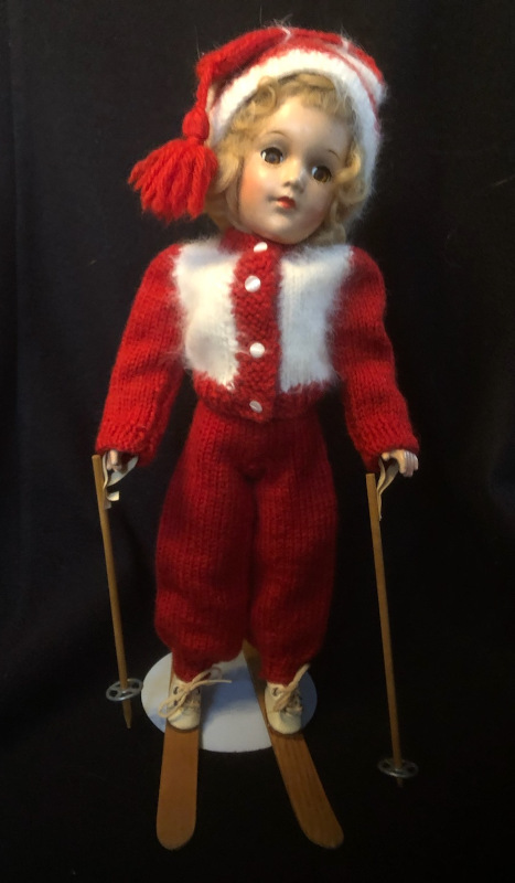 A 14-inch all-composition Mary Hoyer doll in knit outfit with wooden skis and ski poles.