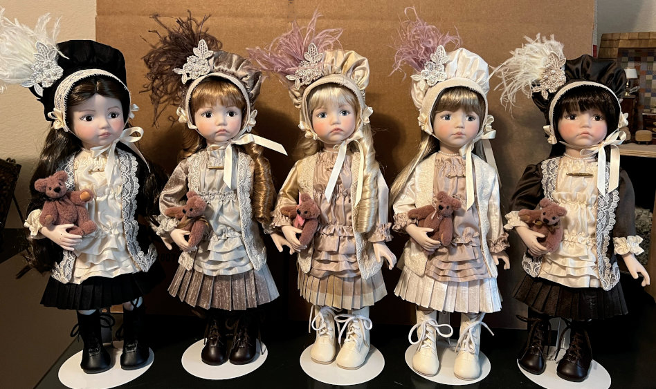 Mize’s completed Victorian-era dolls with their meticulously crafted costumes.
