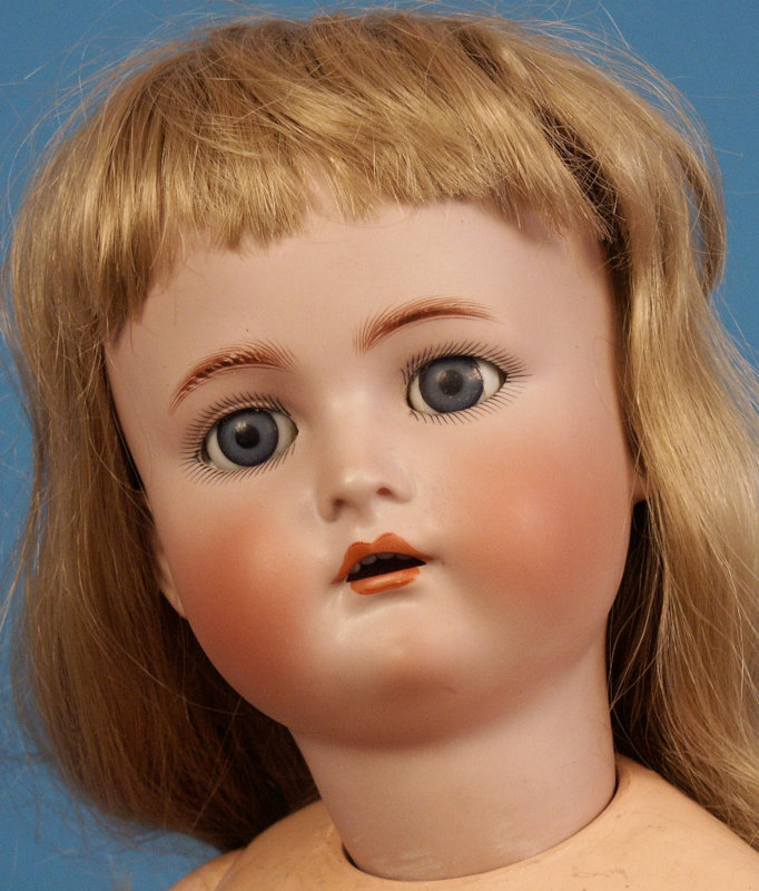This 32-inch K&R child doll has the typical dolly face and ball-jointed composition body the company used for over 30 years.