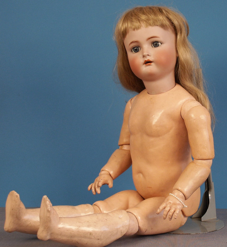This 32-inch K&R child doll has the typical dolly face and ball-jointed composition body the company used for over 30 years.