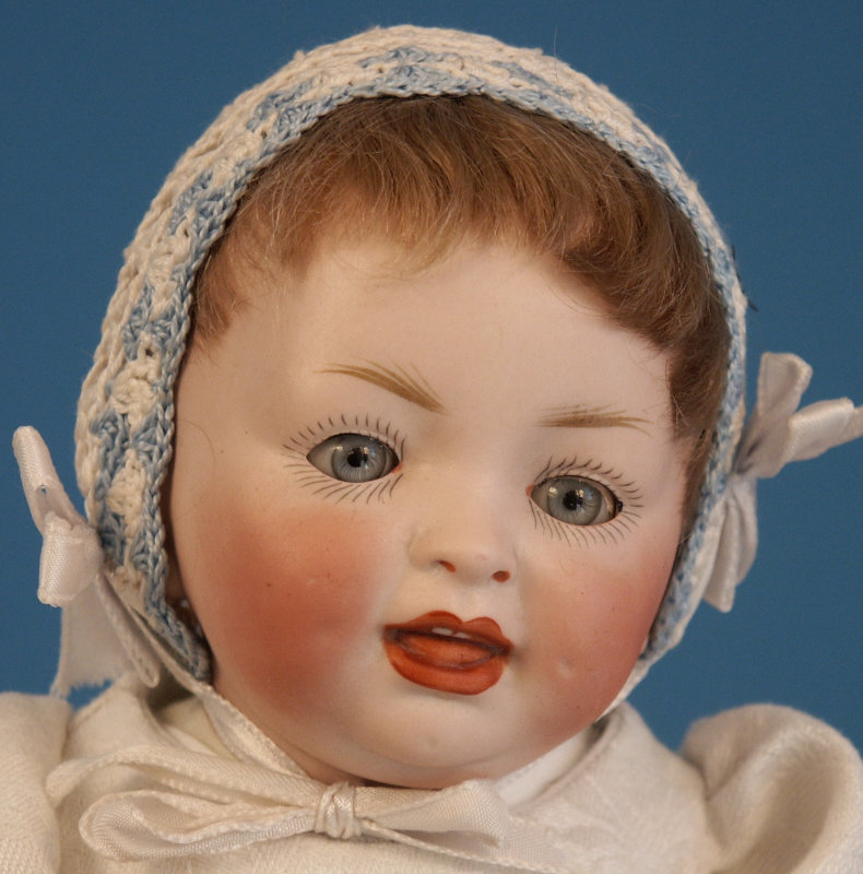 Hertel, Schwab & Co.’s smiling character baby mold 152 on a composition baby body measures 12 inches.