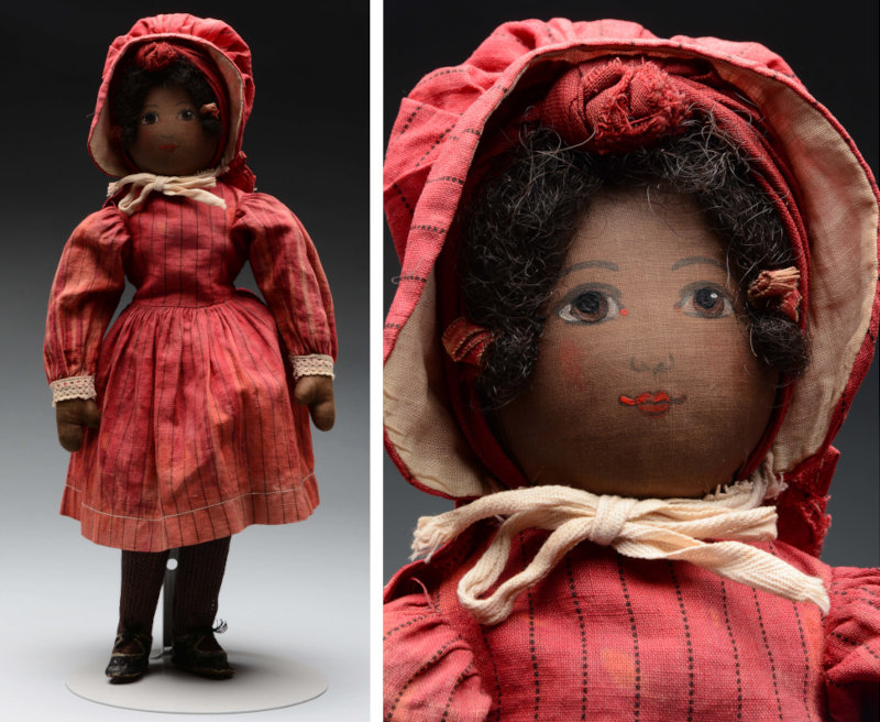 Early brown Babyland Rag Doll with painted facial features and wisps of mohair framing her face; dressed in lovely original dress and bonnet. Photo courtesy of Morphy Auctions