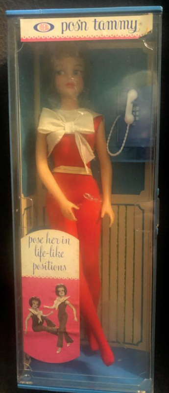 A slimmer, more sophisticated version of the Tammy doll in a box with a clear plastic cover, made to look like a phone booth.