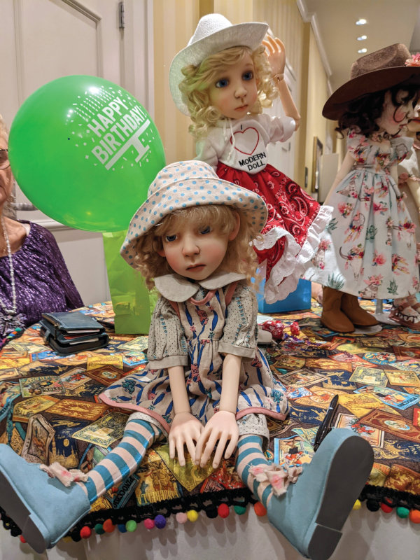 Three BJDs from Connie Lowe's Stella line posed on a table with a balloon decoration that reads "Happy Birthday"