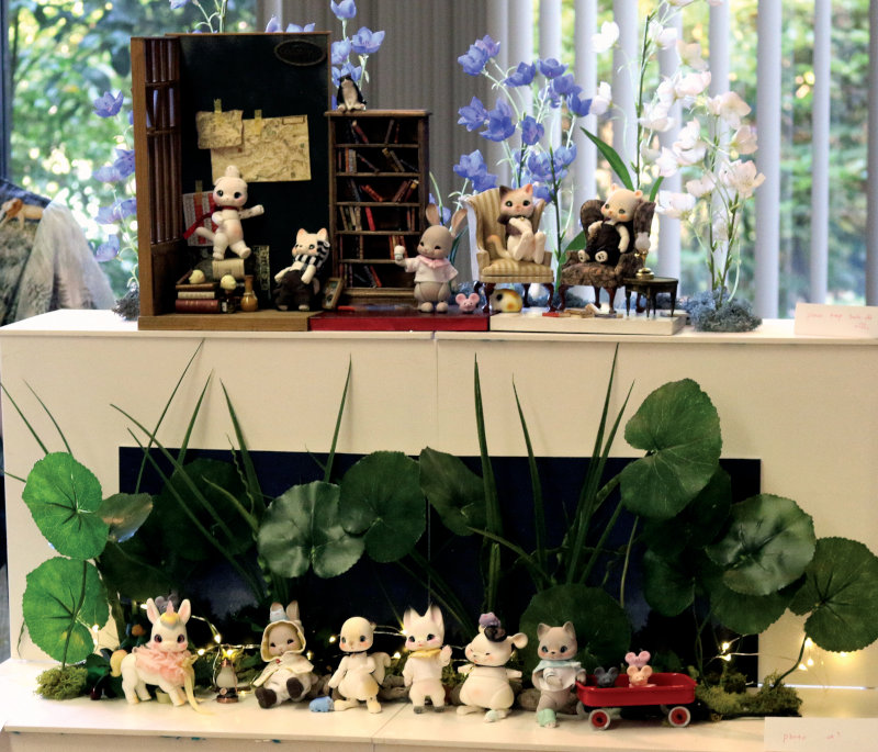 A two-level display of anthropomorphic BJDs in a variety of poses. Includes BJD cats, bunnies, a unicorn, squirrel, and more creatures.