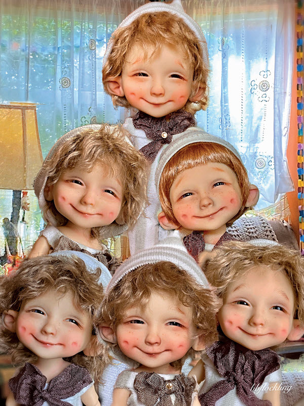 Six dolls are arranged in a pyramid form.