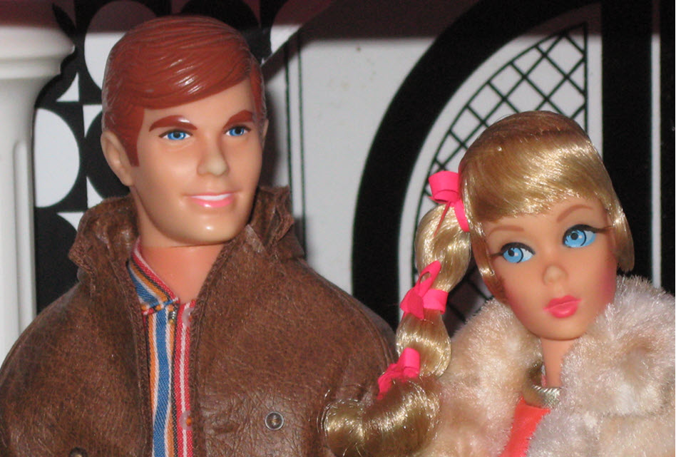 Ken and Barbie are posted next to each other in a close-up photo
