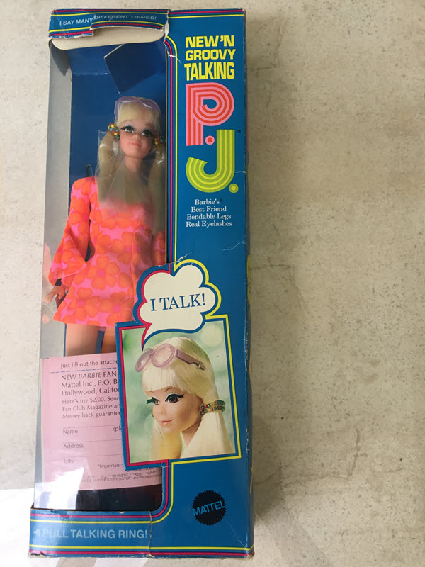 Talking P.J. is shown in her original box