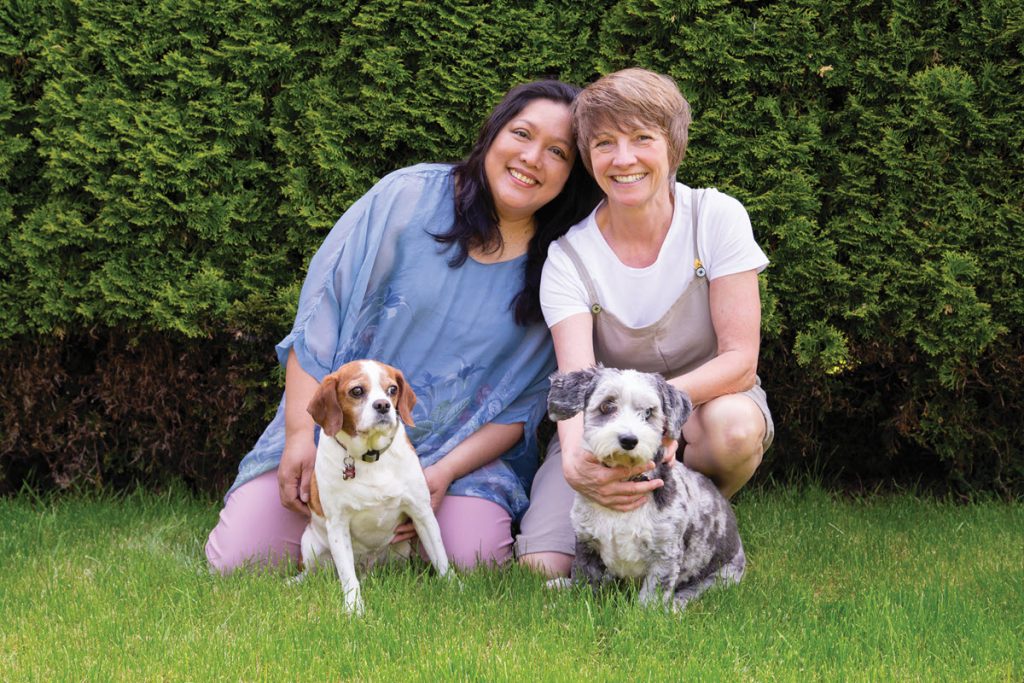 two women with two dogs