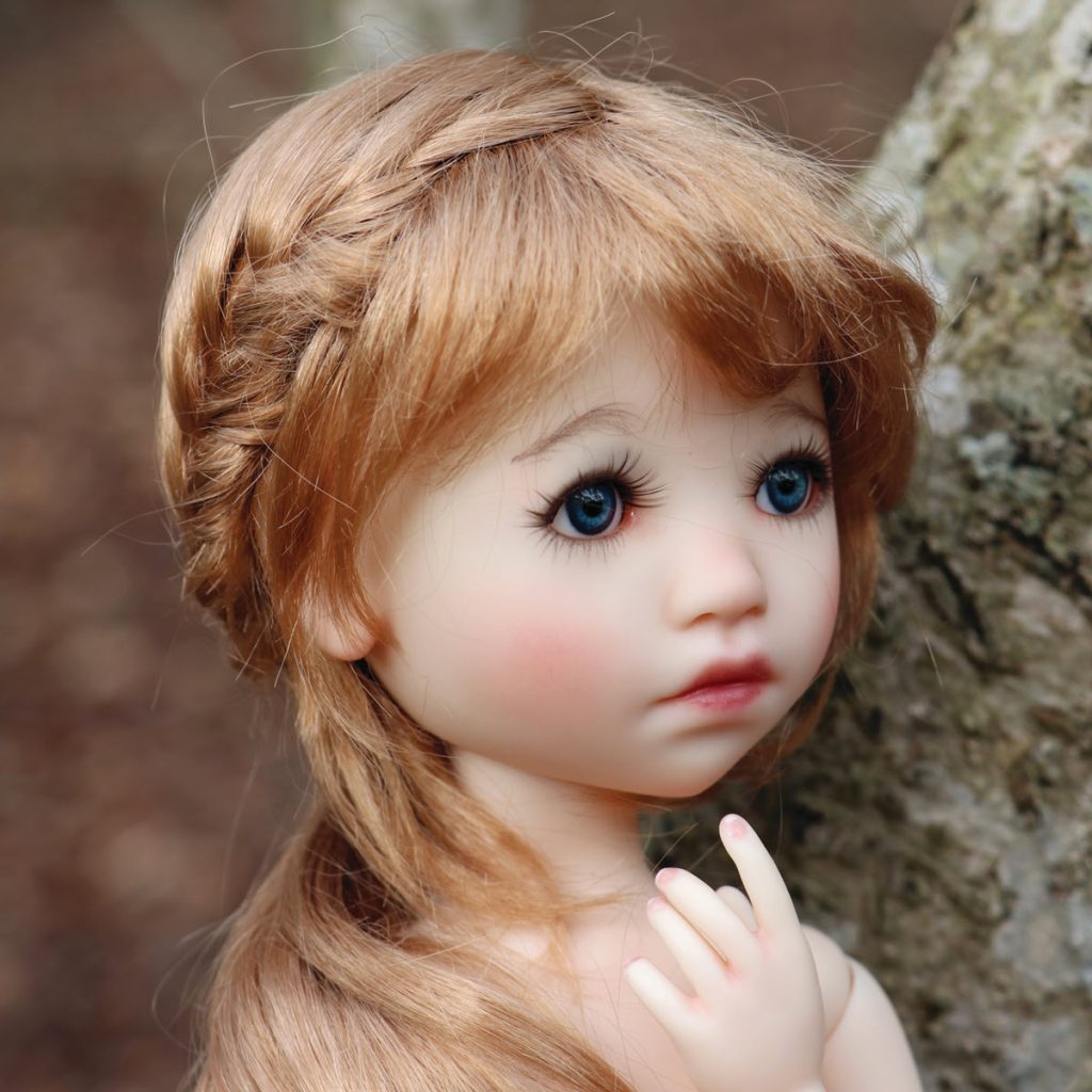doll with bangs and braided hair