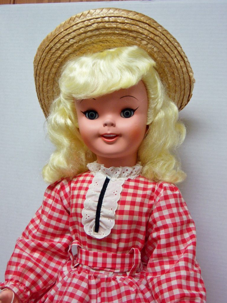 Pollyanna doll in straw hat and red checkered dress